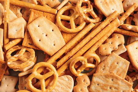 Tasty different crackers as backgroundの写真素材