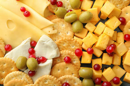 Tasty crackers with cheese and snacks, closeupの写真素材