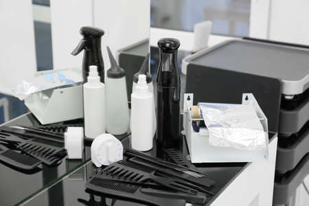 Set of professional hairdresser's tools on table in salonの写真素材