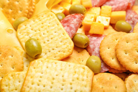 Tasty crackers with cheese and snacks, closeupの写真素材