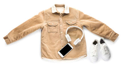 Children's clothes and modern devices on white backgroundの写真素材