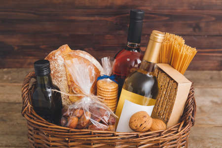 Gift basket with products on wooden backgroundの写真素材