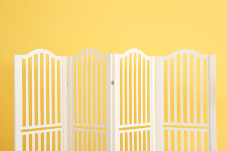 Stylish folding screen near color wallの写真素材