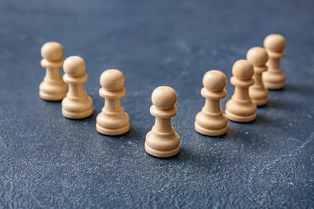 White pawns on color background
