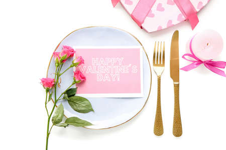 Festive table setting for Valentines Day celebration on white backgroundの写真素材