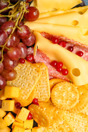Platter with crunchy crackers and cheese, closeupの写真素材