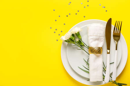 Festive table setting for Valentines Day celebration on color backgroundの写真素材