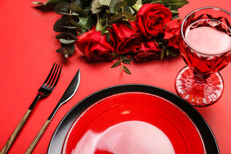 Festive table setting for Valentines Day celebration on color backgroundの写真素材
