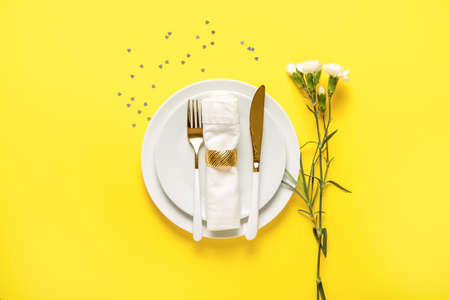 Festive table setting for Valentines Day celebration on color backgroundの写真素材