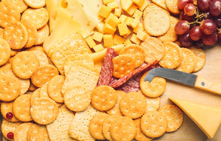 Platter with crunchy crackers and cheeseの写真素材