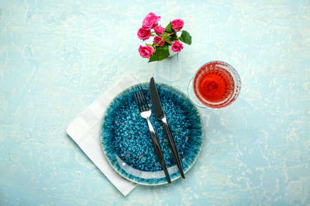 Festive table setting for Valentines Day celebration on color backgroundの写真素材