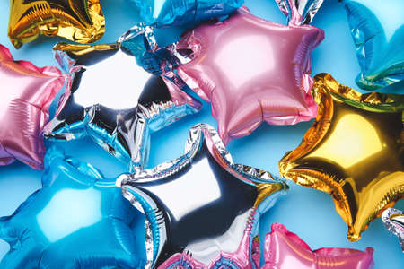 Balloons in shape of stars on color backgroundの写真素材