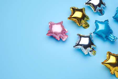 Balloons in shape of stars on color backgroundの写真素材