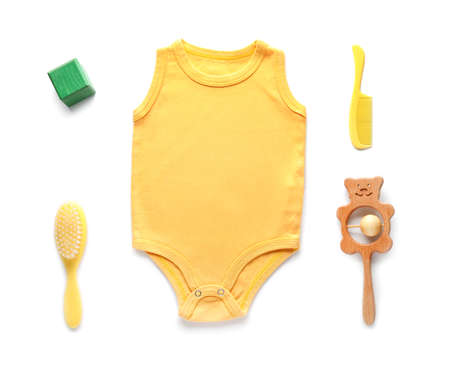 Baby clothes and toys on white backgroundの写真素材