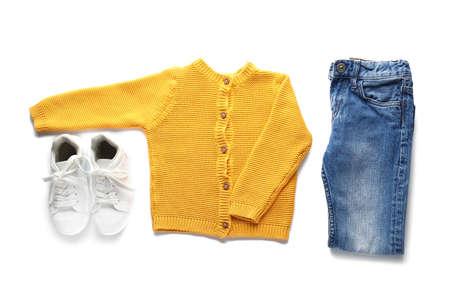 Set of child's clothes and shoes on white backgroundの写真素材