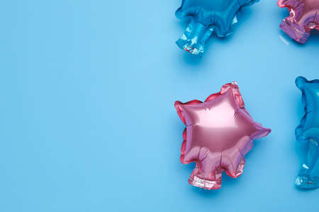 Balloons in shape of stars on color backgroundの写真素材