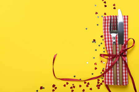 Festive table setting for Valentines Day celebration on color backgroundの写真素材