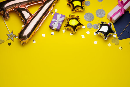 Air balloons and confetti on color backgroundの写真素材