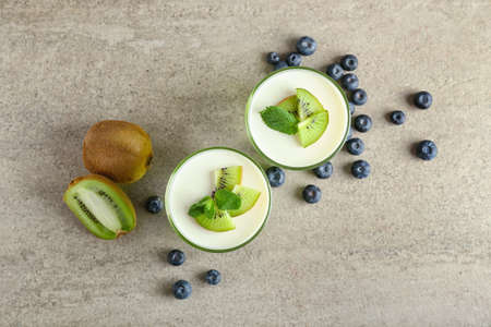 Glasses of tasty jelly on gray backgroundの写真素材