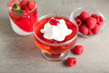 Glasses of tasty jelly on gray backgroundの写真素材