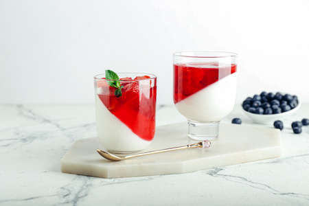 Glasses of tasty jelly on light backgroundの写真素材