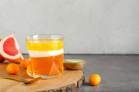 Glass of tasty jelly on gray backgroundの写真素材