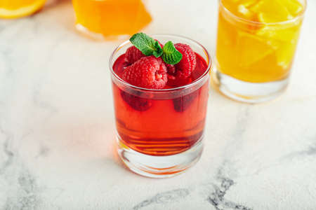 Glasses of tasty jelly on light backgroundの写真素材