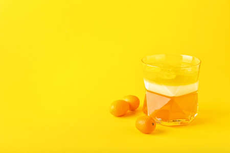 Glass of tasty jelly on color backgroundの写真素材