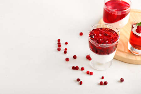 Glasses of tasty jelly on light backgroundの写真素材