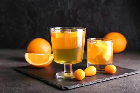 Glasses of tasty citrus jelly on dark backgroundの写真素材