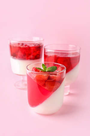 Glasses of tasty jelly on color backgroundの写真素材