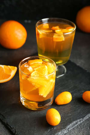 Glasses of tasty citrus jelly on dark backgroundの写真素材