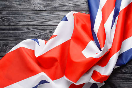 National flag of the United Kingdom on wooden background