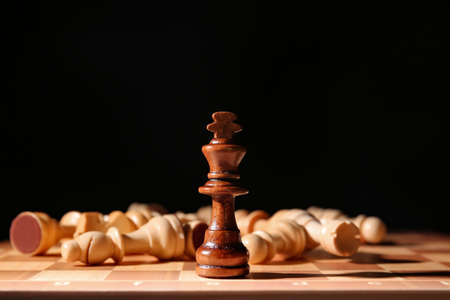 Game board with chess pieces on dark background