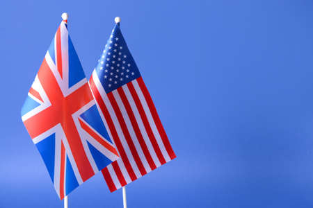 Flags of USA and Great Britain on color backgroundの写真素材
