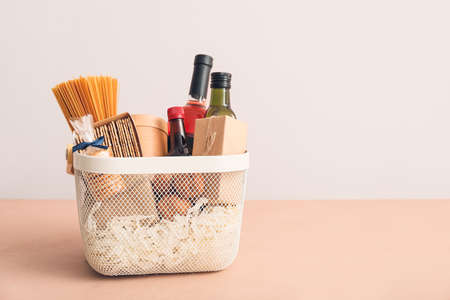 Gift basket with products on color backgroundの写真素材