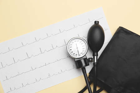 Sphygmomanometer with cardiogram on color background