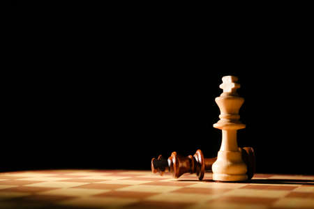 Game board with chess pieces on dark background