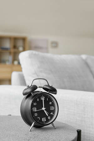 Alarm clock on table in room