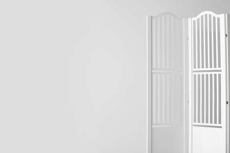 Folding screen near light wallの写真素材