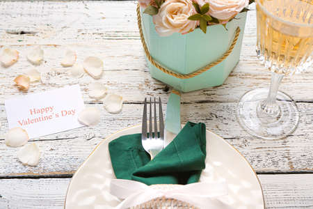 Festive table setting for Valentines Day celebration on white wooden backgroundの写真素材