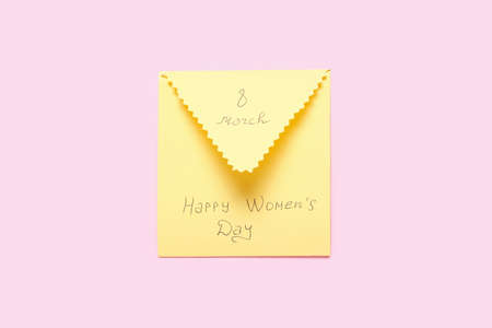 Envelope with text HAPPY WOMEN'S Day on color background