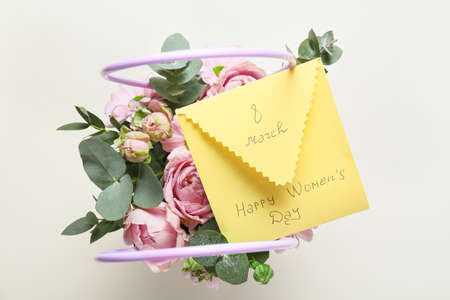 Beautiful flowers and greeting card for International Women's Day on white background