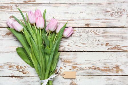 Bouquet of beautiful flowers on white wooden backgroundの写真素材