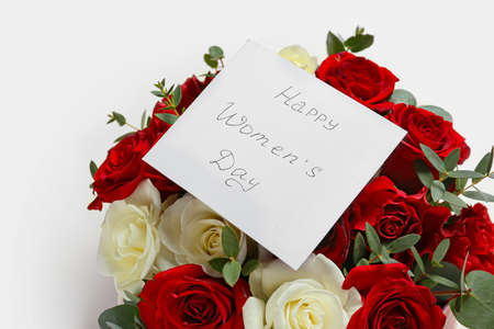 Beautiful flowers and greeting card for International Women's Day on white background