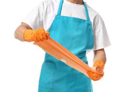 Male janitor with garbage bags on white backgroundの写真素材