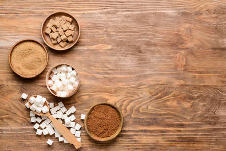 Bowls with sugar on wooden backgroundの写真素材