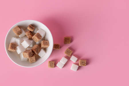 Bowl with sweet sugar on color backgroundの写真素材