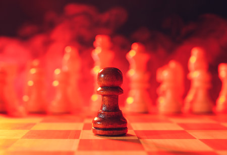 Chess board with pawn on dark color backgroundの写真素材