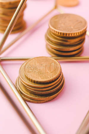 Golden coins on color background